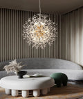 Gold 12 Light Modern Crystal Firework Chandelier With Dandelion Burst Design 21.6 Inch in a stylish living room setting.