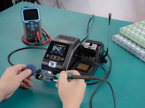 Using Pro Grade 200W Digital Soldering Station Kit With Three F210 And Six F245 Tips on a green workbench