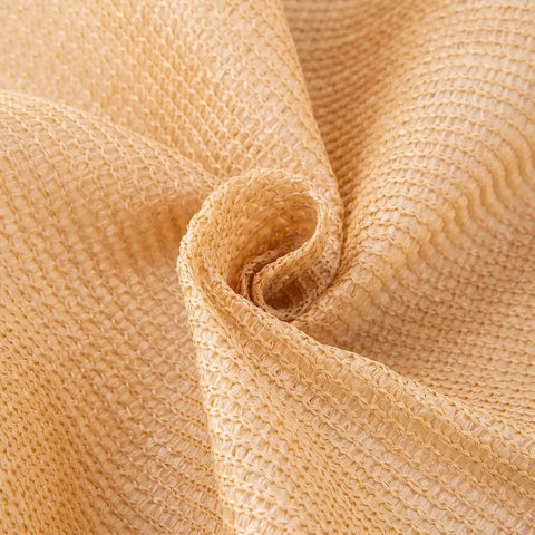 Close-up of sand-colored HDPE mesh fabric for 3 Ft By 50 Ft Privacy Fence Screen Built Tough Mesh Shade Cover For Outdoor Yard Garden Backyard