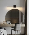 Slick Black Cordless Wall Sconces Set Of Two Wireless Led Accent Lamps With Smooth Stepless Dimming And Handy Remote Zero Wiring Hassle Modern Lighting For Bedrooms Hallways Top Shelf Battery Powered Home Glow Up above a circular mirror in a modern interior.
