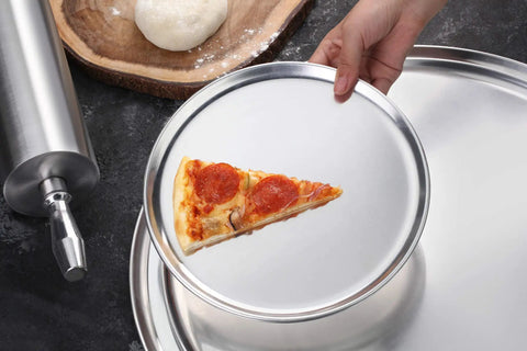 Pro Grade Restaurant Aluminum Pizza Pan 14-Inch Coupe Style Baking Tray Pack Of 6 with pizza slice on pan in use
