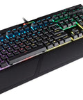 Top Tier Mechanical Gaming Keyboard With Butter Smooth Cherry Red Linear Keys And Killer Per Key RGB Backlighting For Your PC Rig Includes USB Passthrough And Macro Support For That Competitive Edge You Deserve, angled view with RGB illumination.