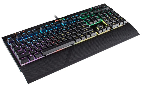 Top Tier Mechanical Gaming Keyboard With Butter Smooth Cherry Red Linear Keys And Killer Per Key RGB Backlighting For Your PC Rig Includes USB Passthrough And Macro Support For That Competitive Edge You Deserve, angled view with RGB illumination.