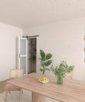 40 Inch Bifold Barn Door Hardware Kit For Two Doors With Heavy Duty Side Mounted Rollers For Smooth Sliding Fits Double 18 Inch Bifold Door Panels Space Saving Folding Solution Doors Not Included, shown installed in a modern dining room.