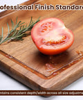 Pro Grade Adjustable Juice Groove Router Jig With Precision Scale And Solid Wood Template Frame For Cutting Boards And Woodworking Creating Perfect Square Grooves Every Time; a close-up view of a juice groove with tomato on a wooden board.