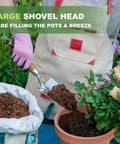 Gardener using Beefy Stainless Steel Bend Proof Garden Trowel With Comfortable Wood Handle to scoop soil into a pot.