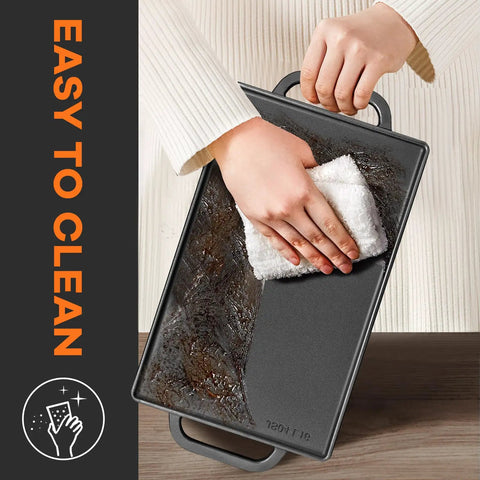 Person cleaning Reversible Cast Iron Grill Griddle With Double Sided Grill Pan For Gas Grills And Stove Tops 13 Inch By 8 Inch
