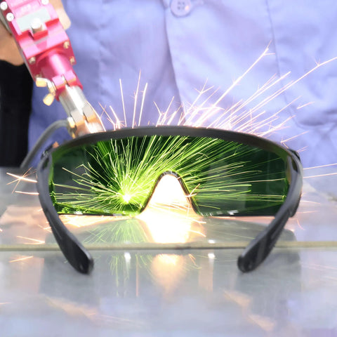 Heavy Duty Laser Safety Glasses For Handheld Welding And Fiber Laser Use, showing green lenses with sparks in use.