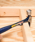 HammerTooth 22 Oz Rip Claw Hammer USA Made Smooth Face Shock Reduction Grip used on wooden board for framing and demolition