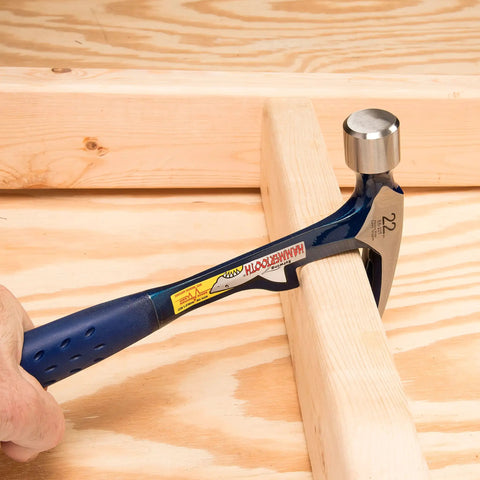 HammerTooth 22 Oz Rip Claw Hammer USA Made Smooth Face Shock Reduction Grip used on wooden board for framing and demolition