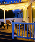 Outdoor patio with illuminated 4 Pack Solar Post Cap Lights for Outdoor Decor Fits 4x4 5x5 6x6 Vinyl and Wood Posts with Black Shells