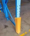 Built Tough Bright Yellow Column Protectors For Parking Garages And Warehouses Durable Pvc Square Post Guards With All Weather Armor 10 Pack mounted on a blue racking system.