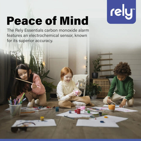 Children playing indoors next to a Rely Essentials carbon monoxide alarm on the wall, highlighting accuracy and peace of mind.