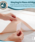 Premium Heavy Duty Extra Large Disposable Bed Pads With Super Grippy Adhesive Strips 40 By 36 Inches Ultra Absorbent Adult Incontinence Underpads Total Mattress Armor 25 Count showing adhesive strips being applied.