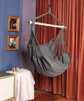 Gray hammock chair hanging rope swing with steel spreader bar anti slip rings handles up to 500 lbs includes two cushions indoor or outdoor use