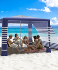 8x8 Beach Cabana With Side Wall Sun Shelter on sandy beach, navy stripes, adjustable height, family sitting underneath enjoying shade