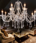 Dope Modern 12 Light K9 Crystal Chandelier Pendant Ceiling Light in European Style for Dining Room, Living Room and Bedroom Clear Glass Drops Bulbs Not Included Requires 12 E12 Bulbs in a living room setting