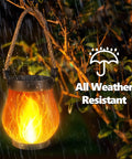 2 Pack Gen2 Solar Lantern Lights With USB C Ultra Real Flame in rain, warm glow illuminating outdoor pathway, weatherproof design