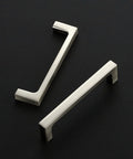 Two brushed nickel drawer pulls on black background, 25 Pack Solid 3-3/4 Inch Kitchen Square Cabinet Handles Brushed Nickel Drawer Pulls Hardware