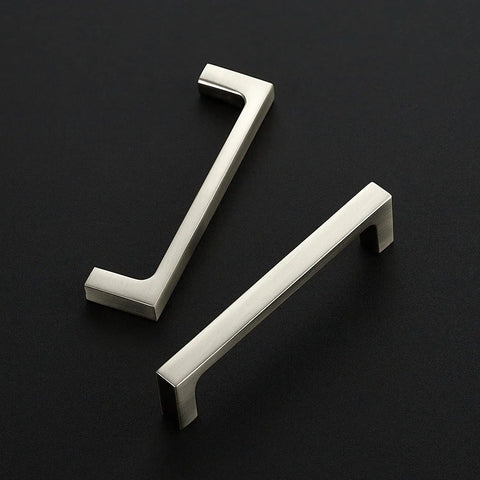 Two brushed nickel drawer pulls on black background, 25 Pack Solid 3-3/4 Inch Kitchen Square Cabinet Handles Brushed Nickel Drawer Pulls Hardware