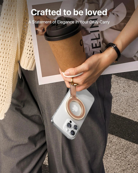 Premium Top Grain Leather MagSafe Phone Grip Holder With Beefy Metal Kickstand And Hella Strong Magnets For No Sweat Daily Carry And Smooth One Handed Control Anywhere, held with coffee and a magazine.