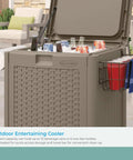 77 Quart Outdoor Patio Cooler With Wheels And Hinged Lid Wicker Look Resin With Built In Storage Basket And Cabinet For Easy Outdoor Entertaining Ready To Roll Weather Resistant Java Finish with full lid, drinks, and basket on patio setting.