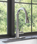 YZZY Single Handle Kitchen Sink Faucet with Pull Down Sprayer Stainless Steel Single Hole Bar Faucet High Arc Chrome Pull Out Kitchen Faucet near window.