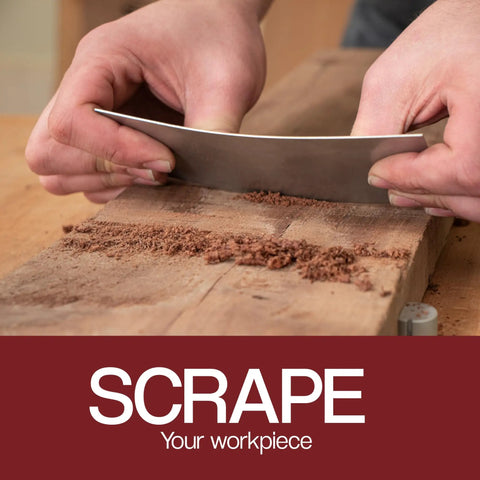 Hands using Cabinet Scraper Burnisher With Six Piece Card Scraper Woodworking Set to smooth wood surface, close view.