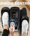 Under Desk Elliptical Machine With LCD Display Electric Seated Pedal Exerciser Portable Quiet Mini Elliptical For Home Use 2 In 1 Power And Manual Modes Compact Low Impact Leg Exerciser For Office Or Living Room Dark Black with remote control and user feet on pedals.