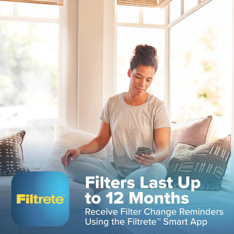 Person using smartphone with Filtrete app in bright room, Filtrete 16x25x4 Refillable Air Filter replacement info displayed.