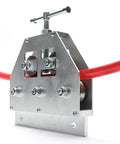 Close-up view of Tubing Straightener For 3/16 To 1 Inch Coiled Brake And Fuel Line Tubing with bench clamp and red tubing.