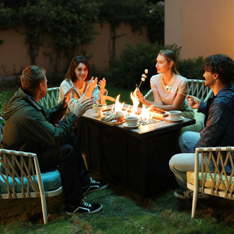 Friends gathered around a 42 Inch Propane Fire Pit Table With Ceramic Top 2 In 1 Fire Table Turns Any Patio Into A Cozy Lounge Black Outdoor Gas Firepit For Backyard Deck Or Patio Rectangular Shape, enjoying an evening outdoors.