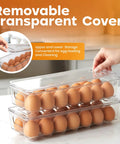 Clear 14 Slot Egg Container With Lid And Handle For Fridge Stackable Egg Tray Organizer for Kitchen Storage, two stacked trays holding eggs.