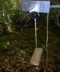 Backyard Zip Line Kit With 200 Feet Of Galvanized Cable And Aluminum Trolley For Epic Backyard Thrills in use between trees