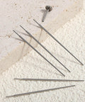 Six Pack 20G Piercing Taper Insertion Tool Set For Flat Back Earrings shown on a textured surface, highlighting stainless steel material and precise tips.