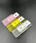 Pink Ding Ding Fidget Slider For Adults Kick Stress To The Curb With This Grab And Go Everyday Carry Gadget in pink, yellow, and clear.