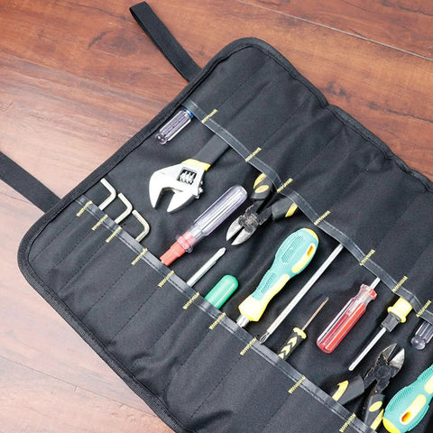 Open black tool roll with assorted tools inside, not a Portable Canvas Knife Roll Bag For Chef Knives And Cutlery