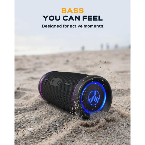 Waterproof Bluetooth Speaker 30W with 360 Degree Sound and Deep Bass IPX7 TWS Pairing Party Ready RGB Lights on beach sand.