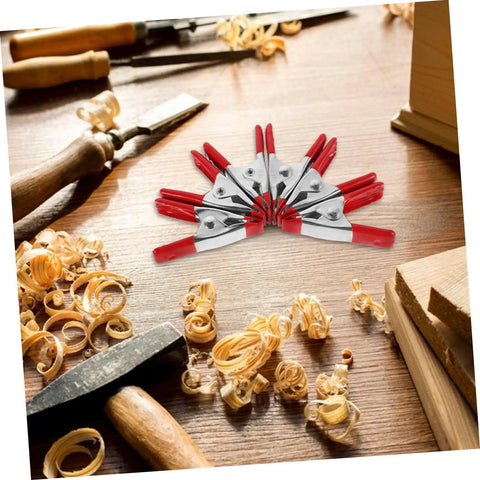 12 Pack Heavy Duty Metal Spring Clamps Kit For Woodworking Pros And DIY Gurus Offering Insane Grip Power For Crafts Dress Fitting Garlands And Household Projects You Need Right Now. Red metal spring clamps on woodwork bench