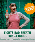 Person holding Fresh Breath Mouthwash With OXYD8 And Zinc Gluconate To Knock Out Bad Breath, Peppermint Flavor in pink outfit