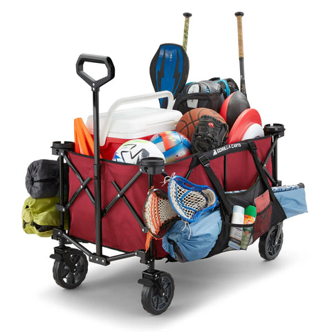 Heavy Duty Collapsible Outdoor Utility Wagon With Oversized 36 By 21 By 15 Bed And 150 Pound Capacity Red Foldable Rolling Cart loaded with sports gear and camping equipment
