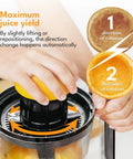 Hand using Lebenlang Electric Orange Juicer With Two Cones BPA-Free, showing maximum juice yield with automatic direction change.