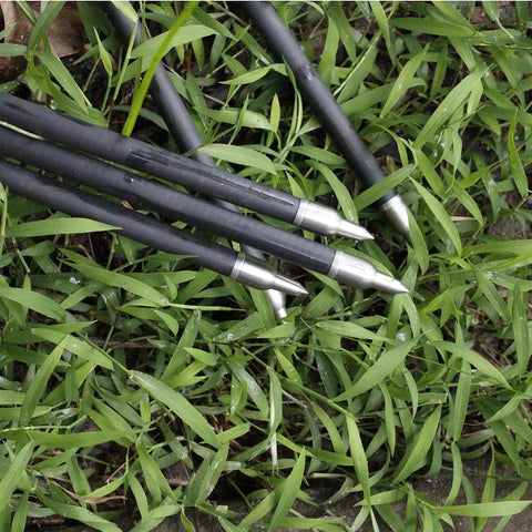 Beefy 100 125 150 175 200 Grain Stainless Steel Field Points Set on grass, showing arrow tips and shaft compatibility.