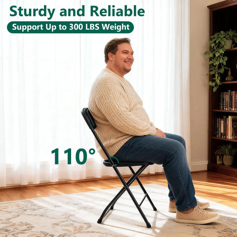 Man sitting on 4 Pack Black Plastic Folding Chairs With Steel Frame For Outdoor Use No Fuss Portable Stackable Foldable Seating 350 Lb Capacity