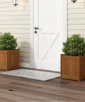 Front view of Two Pack Teak Oil Finished Meranti Wood Flower Planter Boxes in a garden setting, 15.4 x 17.7 x 15.4 inches.