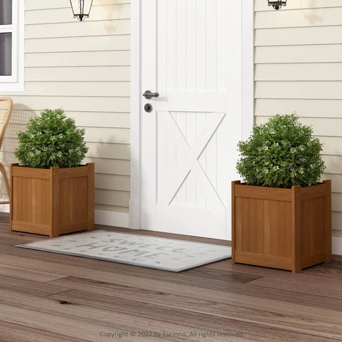 Front view of Two Pack Teak Oil Finished Meranti Wood Flower Planter Boxes in a garden setting, 15.4 x 17.7 x 15.4 inches.