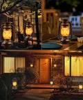 Outdoor Solar Lanterns 2 Pack Waterproof Bronze Flickering Flame Lights illuminating garden and patio with warm amber glow at night