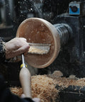 Heavy Duty 1 Inch Diameter Woodturning Lathe Tool Rest Set in use, shaping a wooden bowl with shavings flying.