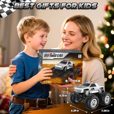 Child holding All Terrain Remote Control Truck Beast With 360 Degree Spins And Lights Rechargeable RC Car box with parent.