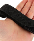 Close-up of a black strap for Adjustable Lawn Aerator Shoes Straps With Spikes For Garden Soil Aeration Patio Gardening Sandals Tool Set